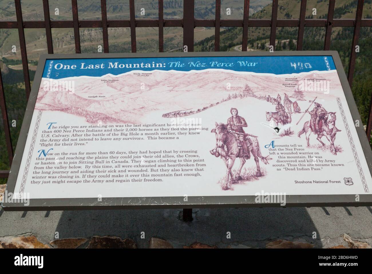 Dead Indian Pass, Wyoming / USA - July 14, 2014:  A metal sign explaining the Nez Perce War displayed at the summit of Dead Indian Pass in Wyoming. Stock Photo