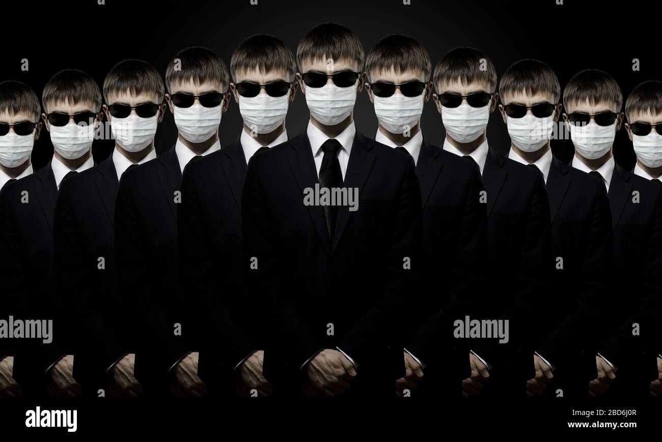 group of man in black costume in medical mask, Stock Photo