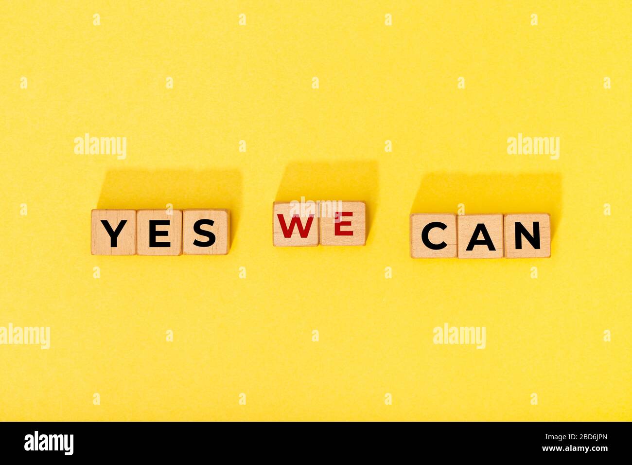 Yes we can message on wooden blocks. Motivational Words Quotes Concept Stock Photo