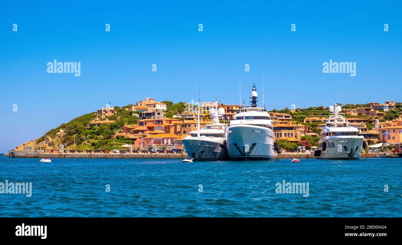 Porto Cervo, Sardinia / Italy - 2019/07/20: Panoramic view of luxury yacht port, marina and residences of Porto Cervo resort at the Costa Smeralda Stock Photo
