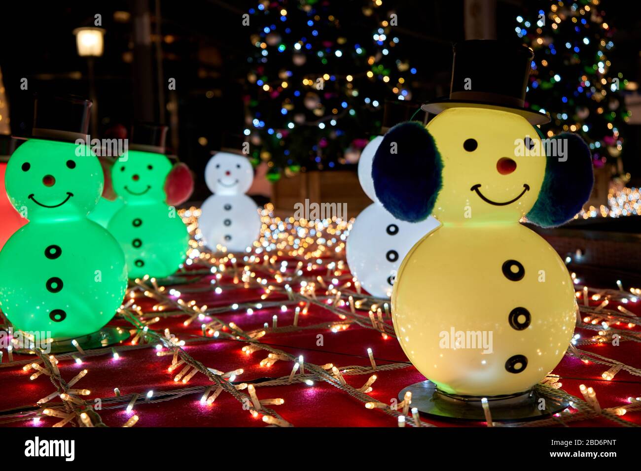 Snowmans and Christmas tree with various decorations Stock Photo