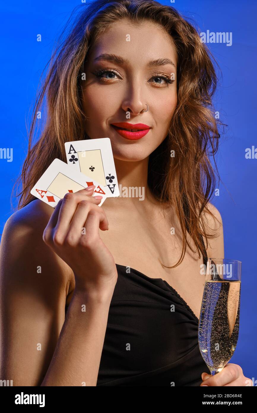 Alluring Brunette Model With Bright Make Up And Earring In Nose In Black Dress She Holding Glass Of Champagne And Two Playing Cards Smiling Posing Stock Photo Alamy