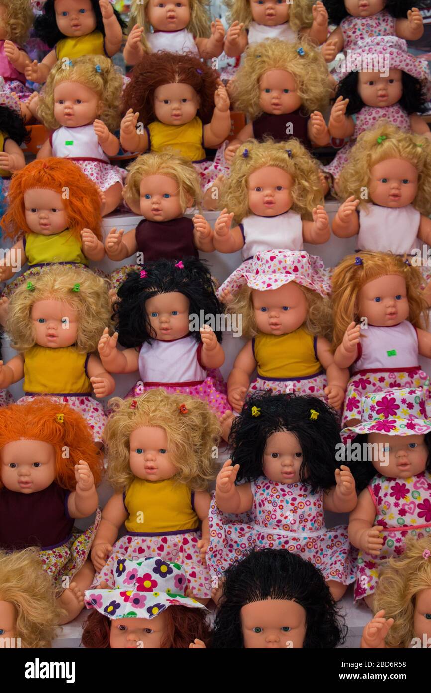 set of beautiful dolls with various clothes on Stock Photo