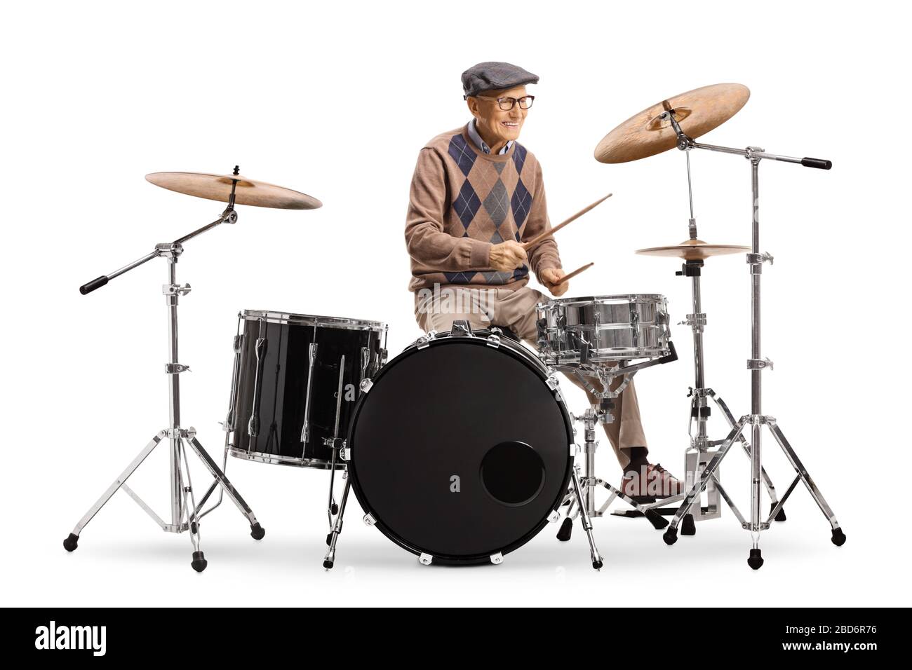 Senior man playing drums isolated on white background Stock Photo