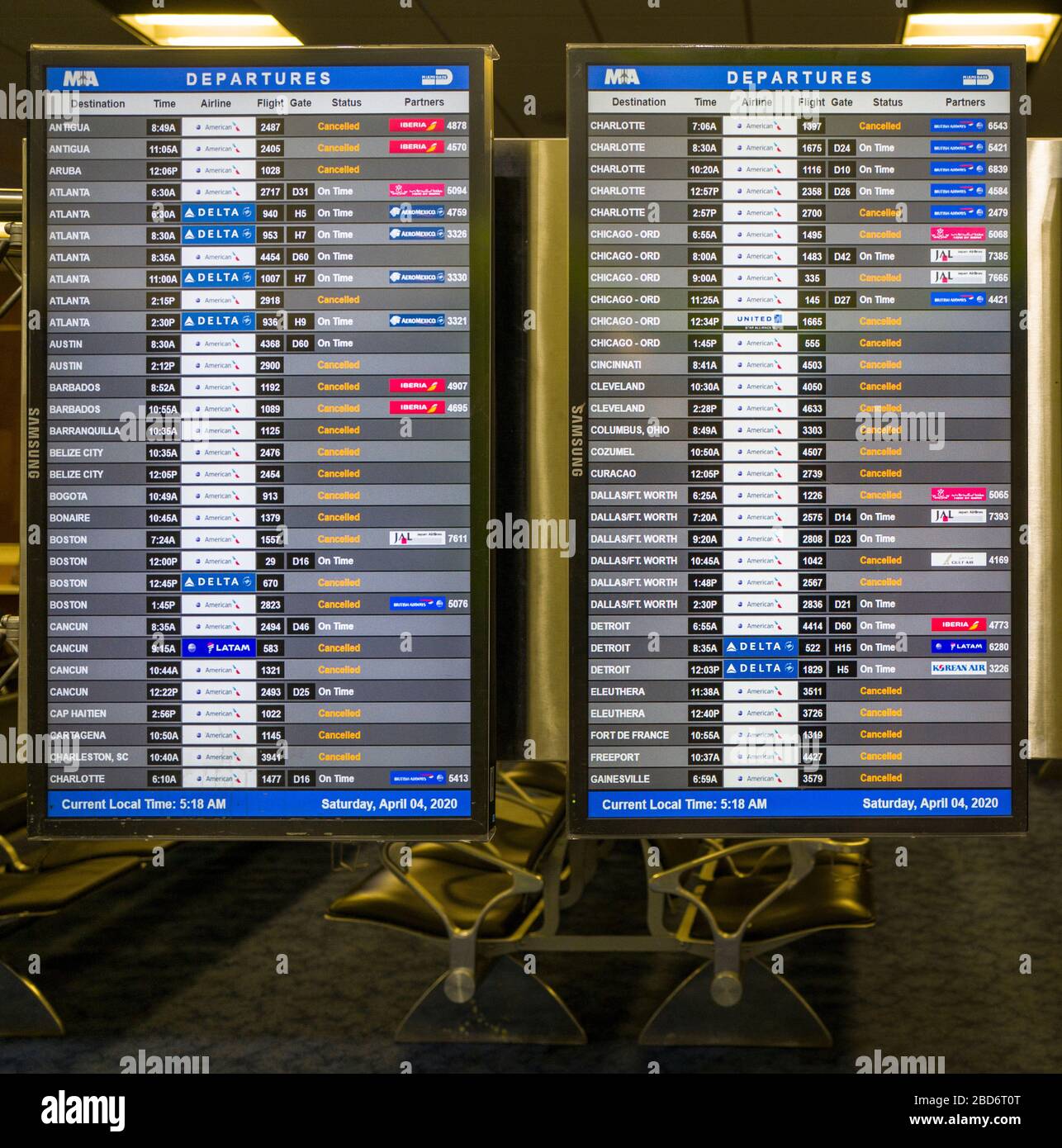 Flight Schedule Display at the Miami International Airport showing the majority of the Flights were cancel during the Coronavirus COVID-19 Pandemic. Stock Photo