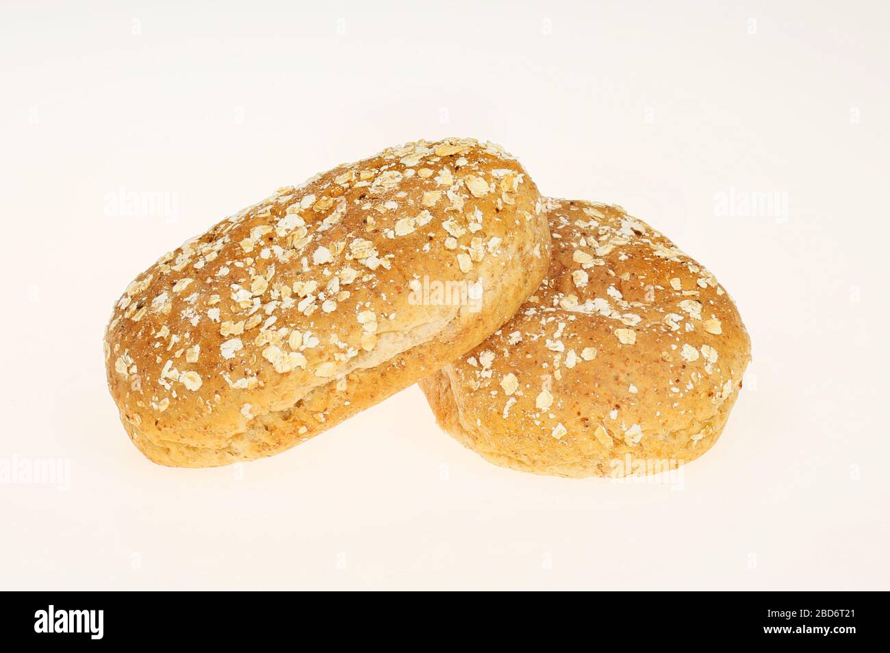 Two wholemeal bread rolls isolated against white Stock Photo