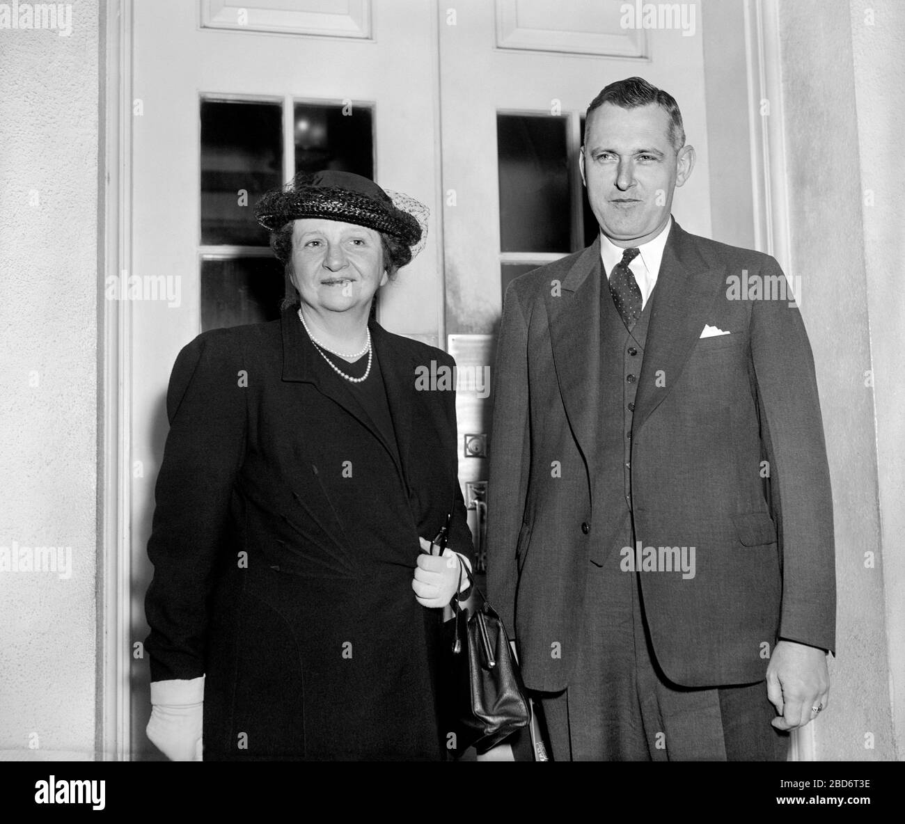 U.S. Secretary of Labor Frances Perkins and Dr. John R. Steelman, Chief of the Mediation Service, leaving White House today after Conference with U.S. President Franklin Roosevelt to discuss struggle between United Mine Workers and Harlan County, Kentucky Operators, Washington, D.C., USA, Harris & Ewing, May 17, 1939 Stock Photo