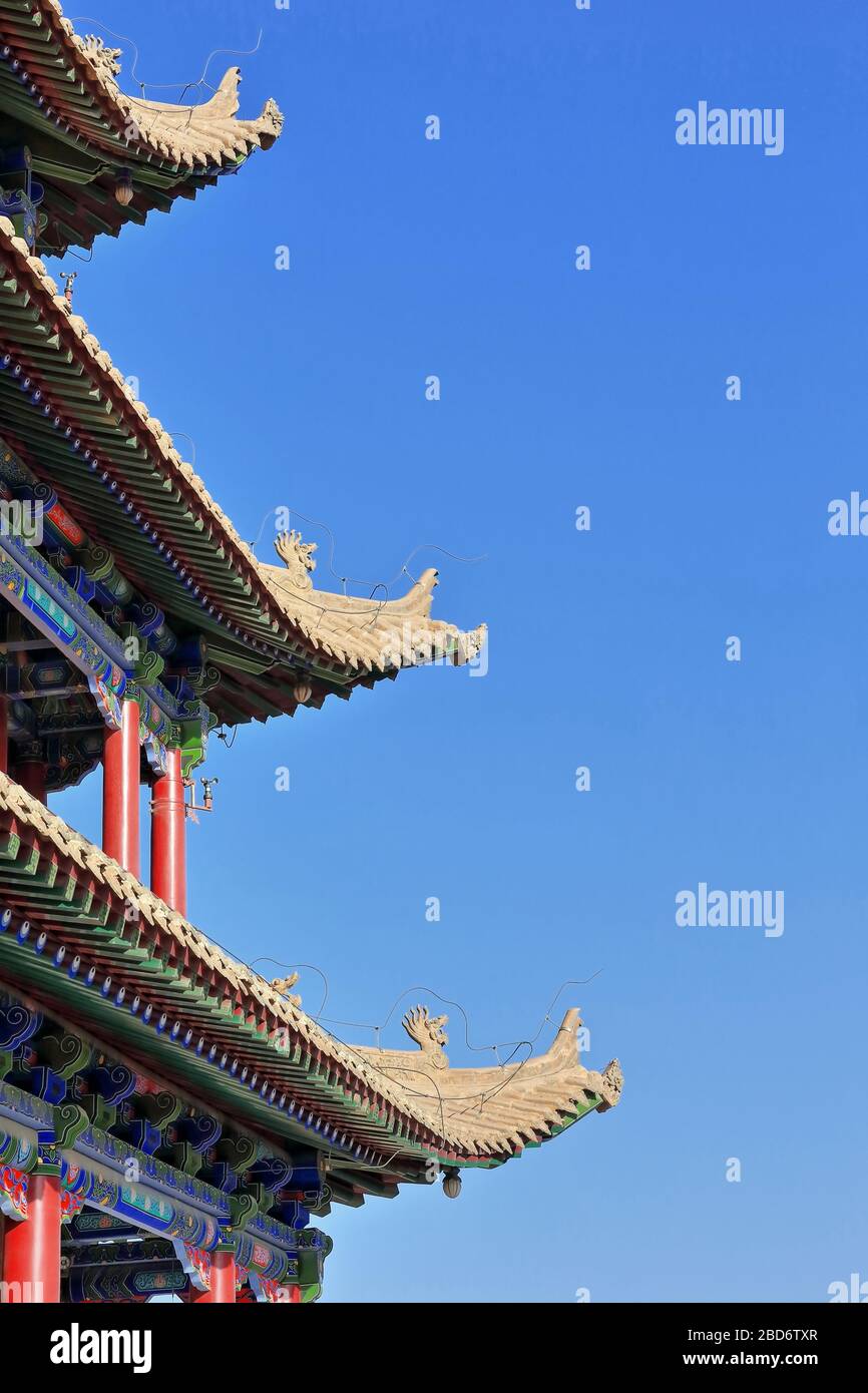 Upturned eaves with chiwen and chishou ornate-Xieshan style roof-Jiayuguan fortress-Gansu-China-0768 Stock Photo