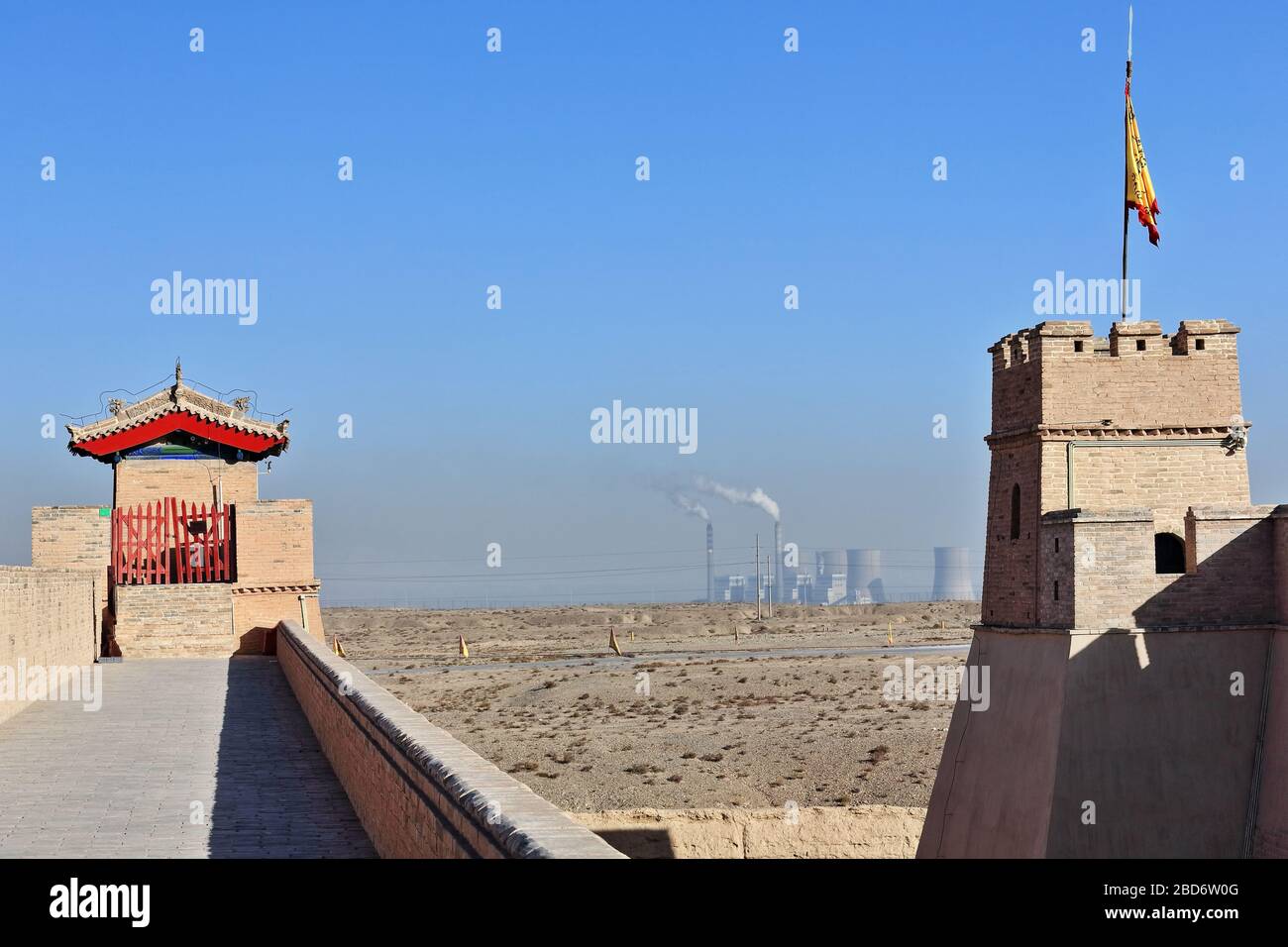 Turrets-inner and outer walls NW.corners-steel mills background-Jiayu Guan Pass-Jiayuguan City-Gansu-China-0774 Stock Photo