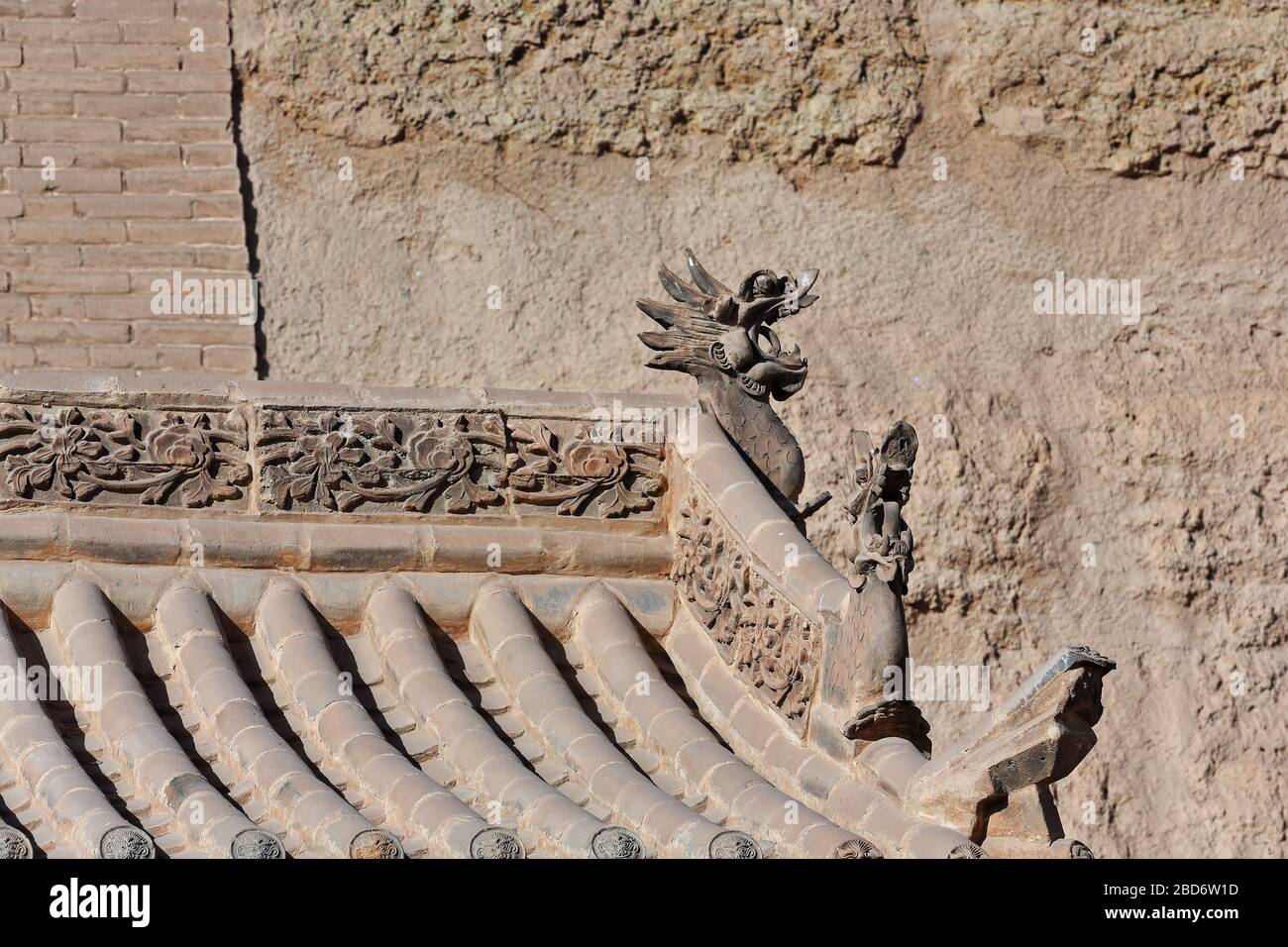 Ornate roof-inner city brick wall-hornless dragon-floral motif. Jiayu Guan Pass-Jiayuguan-Gansu-China-0783 Stock Photo