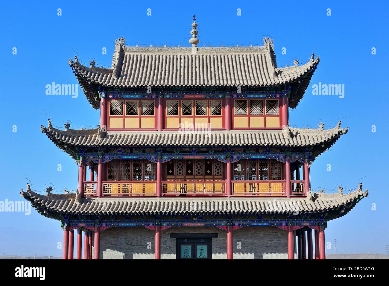 Upturned eaves-chiwen and chishou ornate-Xieshan roof-Gate of Sighs tower-Jiayuguan fortress-Gansu-China-0785 Stock Photo
