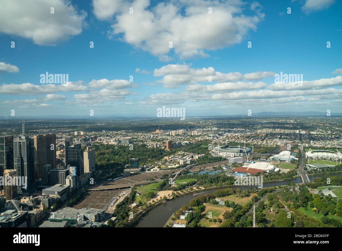 Aerial view Melbourne urban central business district with Melbourne Cricket Ground across  Yarra River, Australia. Stock Photo