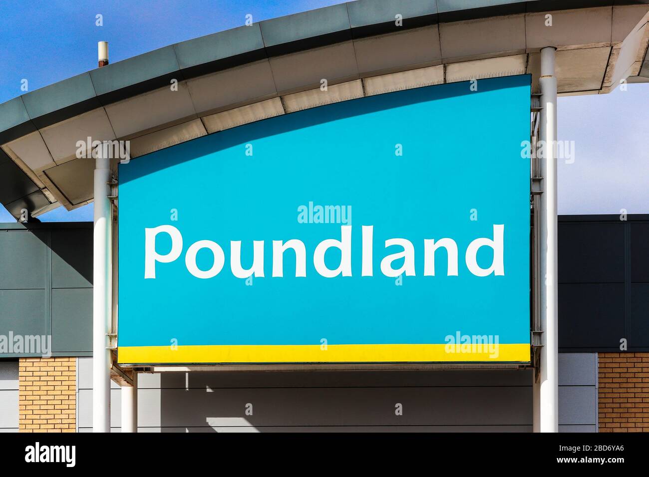 Poundland company logo above a shop entrance, Kilmarnock, UK Stock Photo