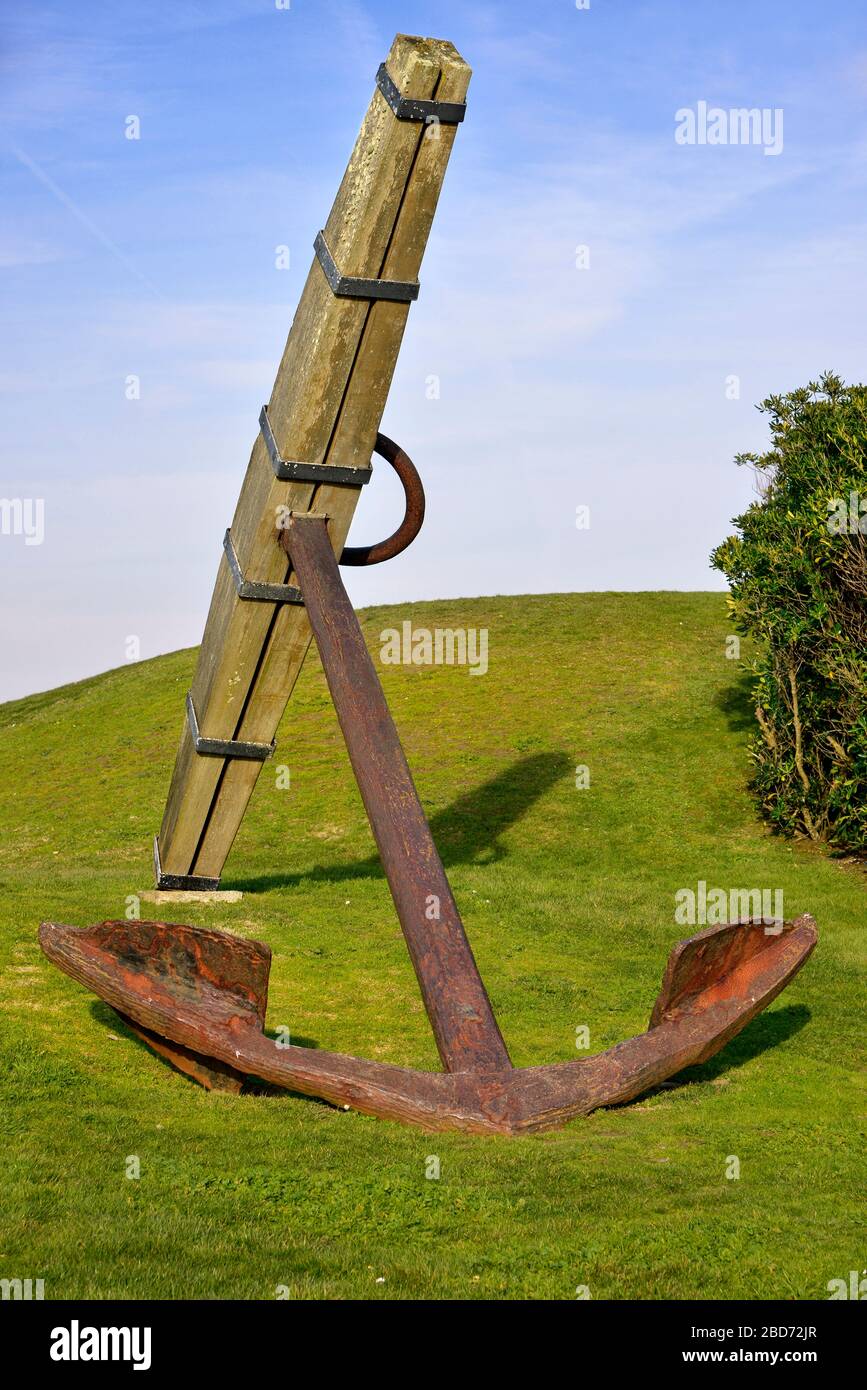 Old marine anchor on grass at Les Sables d'Olonne in France, commune in the Vendée department in the Pays de la Loire region in western France Stock Photo