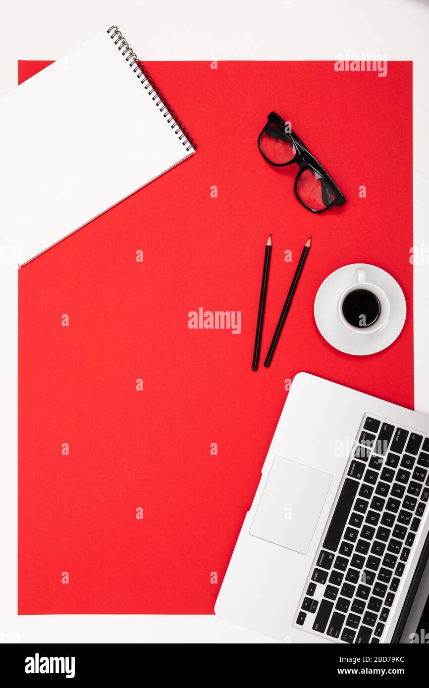 flat view of the office desk with a creative arrangement of stationery