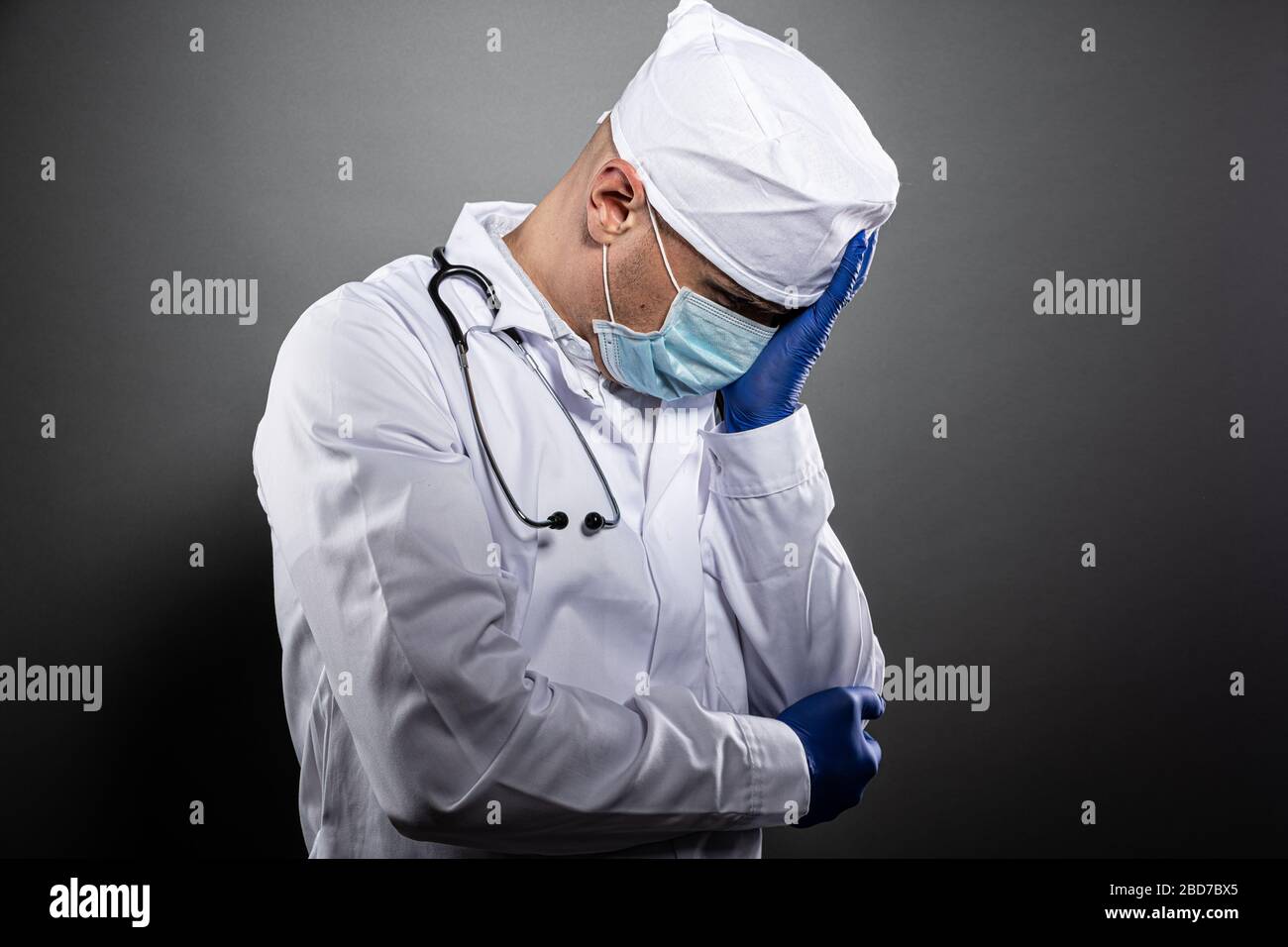 Overworked tired doctor during coronavirus covid-19 epidemic Stock Photo