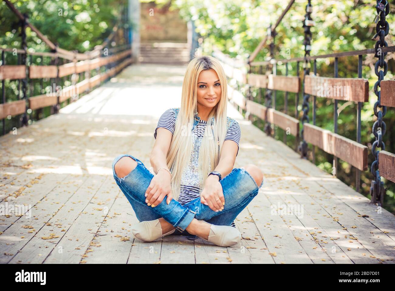 Long Legs Fashion Blonde Girl Sitting On Bench. Street Fashion. Urban  Lifestyle. Young Beautiful Woman Walking Outdoor. Focus On Legs. Stock  Photo, Picture and Royalty Free Image. Image 31001659.