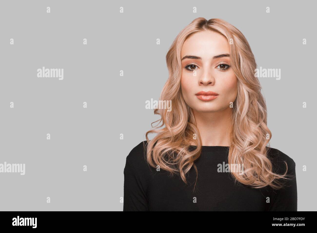 Portrait of a young caucasian woman with flowing hair. Stock Photo