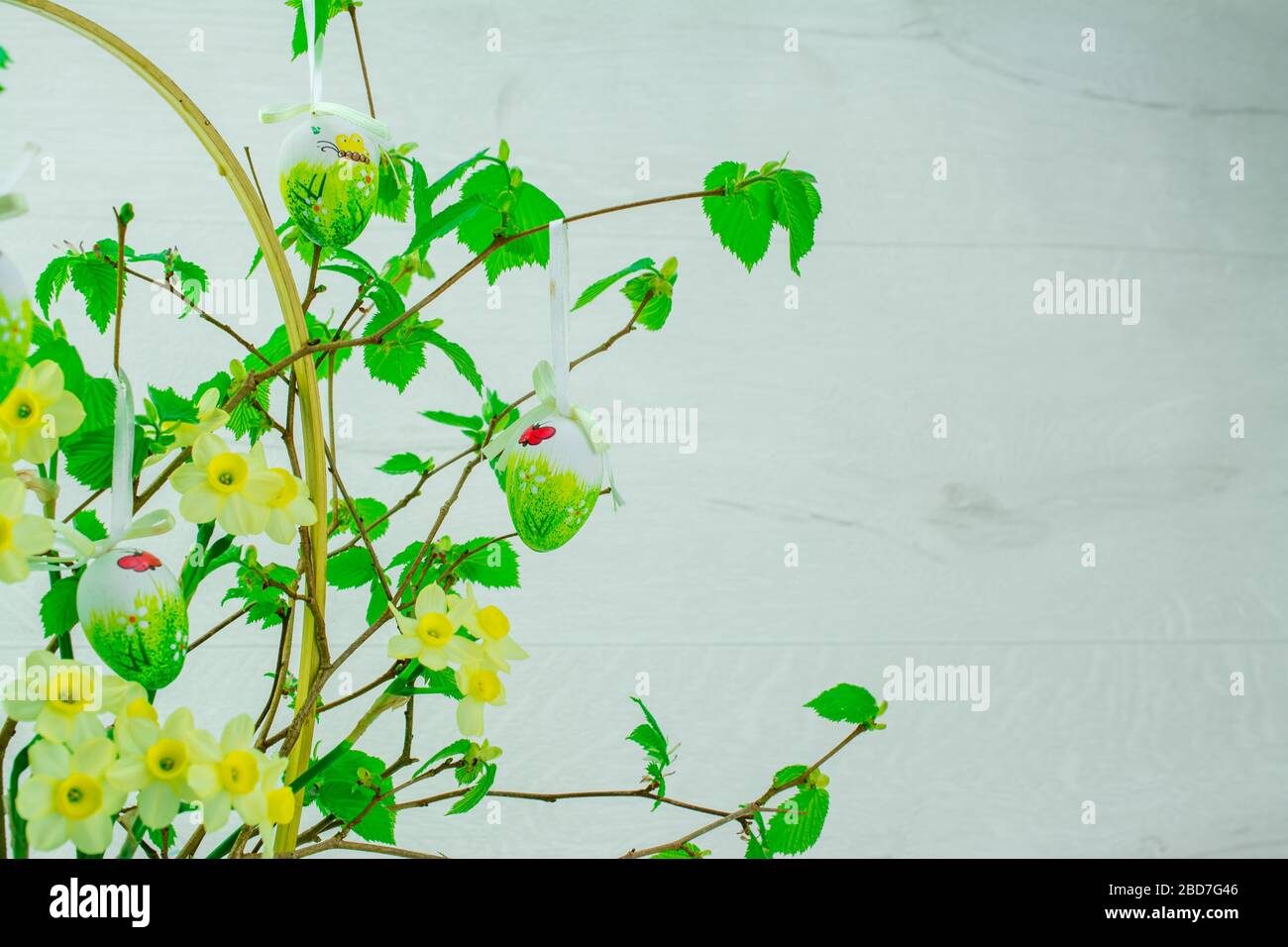 Green tree branch with Easter eggs Stock Photo