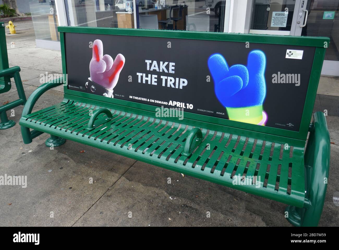 Los Angeles, California, USA 1st April 2020 A general view of atmosphere of Trolls World Tour on Bus bench with empty streets due to outbreak of Coronavirus as people practice social distancing during Stay At Home order on April 1, 2020 in Los Angeles, California, USA. Photo by Barry King/Alamy Stock Photo Stock Photo