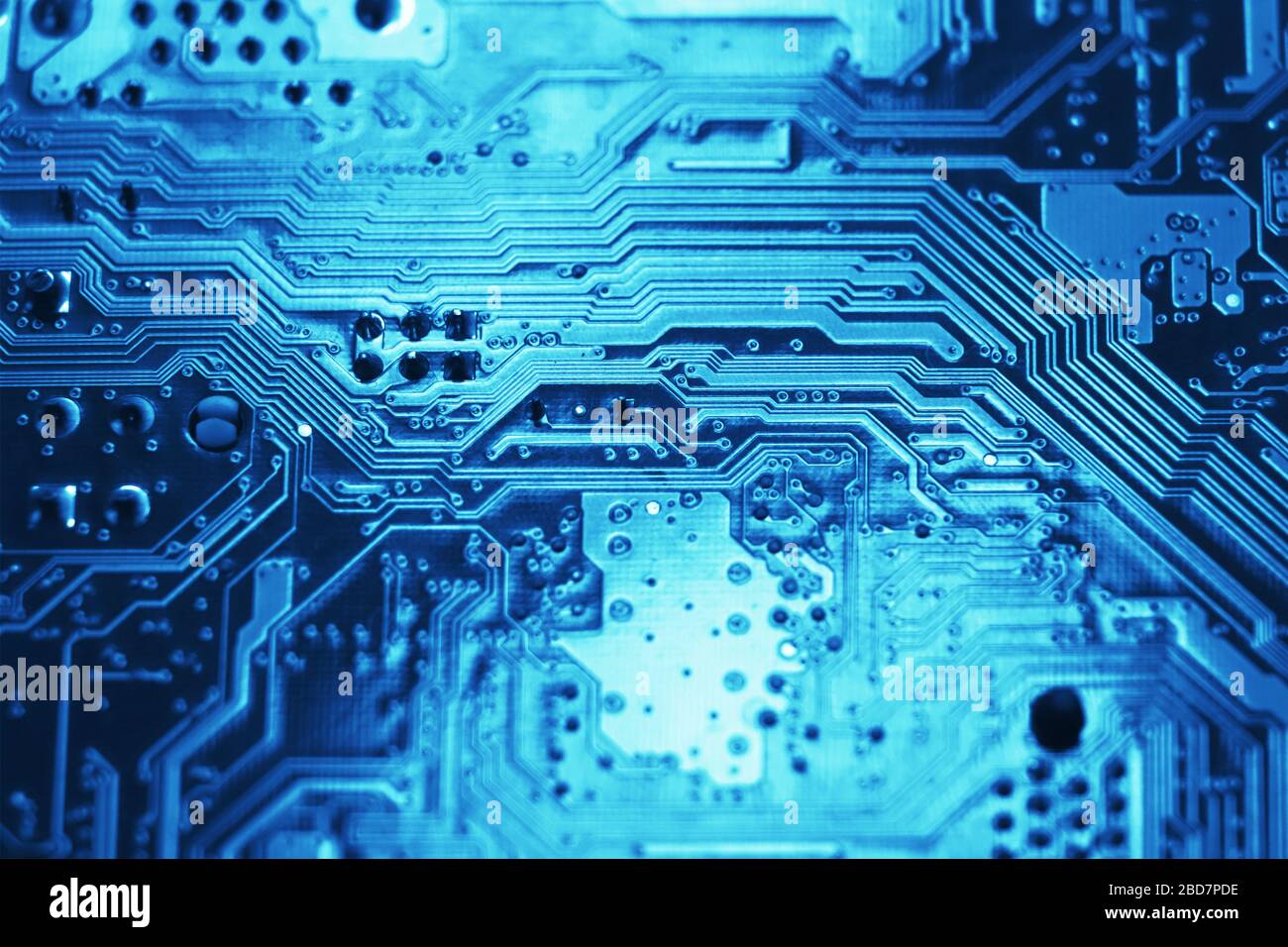 Blue electronic mother board circuit close up macro background. Stock Photo