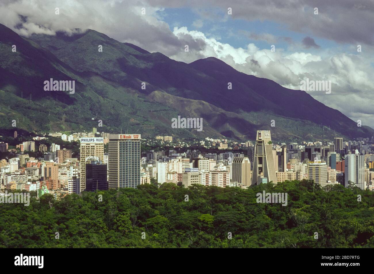 CARACAS, VENEZUELA, DECEMBER 1987- Tall buildings in city of Caracas and Avila National Park, above. Stock Photo