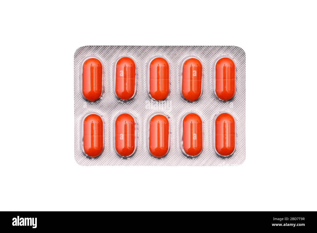 Orange pills in blister pack isolated on white background. Pack of