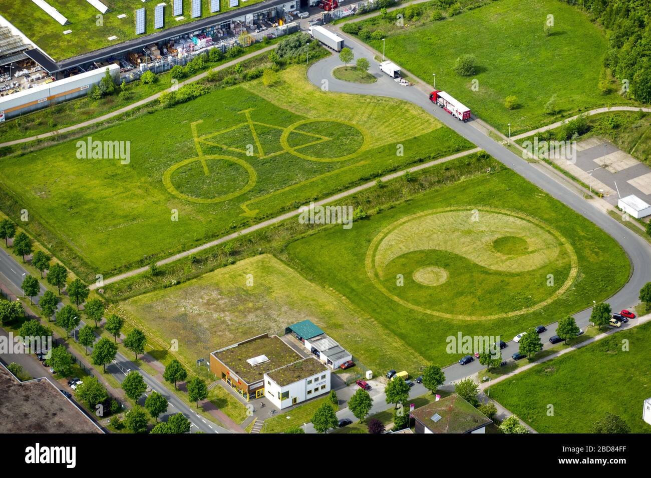 , meadow with mowed bicycle and ying-yang character, 11.05.2015, aerial view, Germany, North Rhine-Westphalia, Ruhr Area, Hamm Stock Photo