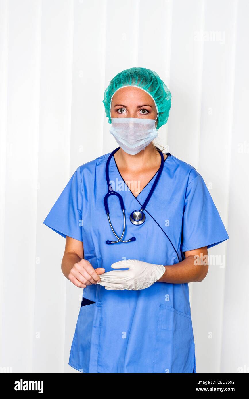 female surgery doctor in srubs, symbol for working in a hospital Stock Photo