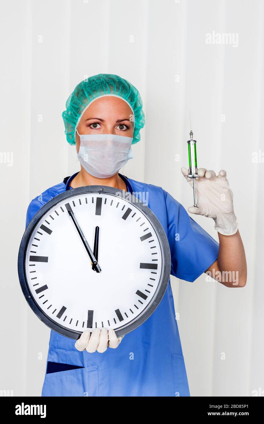 female surgery doctor in srubs, holding a clock, 5 before 12, symbol