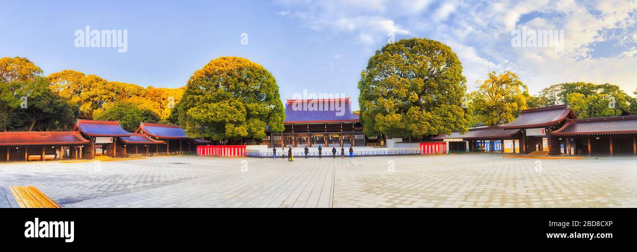 Meiji Jingu shrine in Tokyo city - wide panorama around central yard in soft morning light with no crowds of tourists. Stock Photo