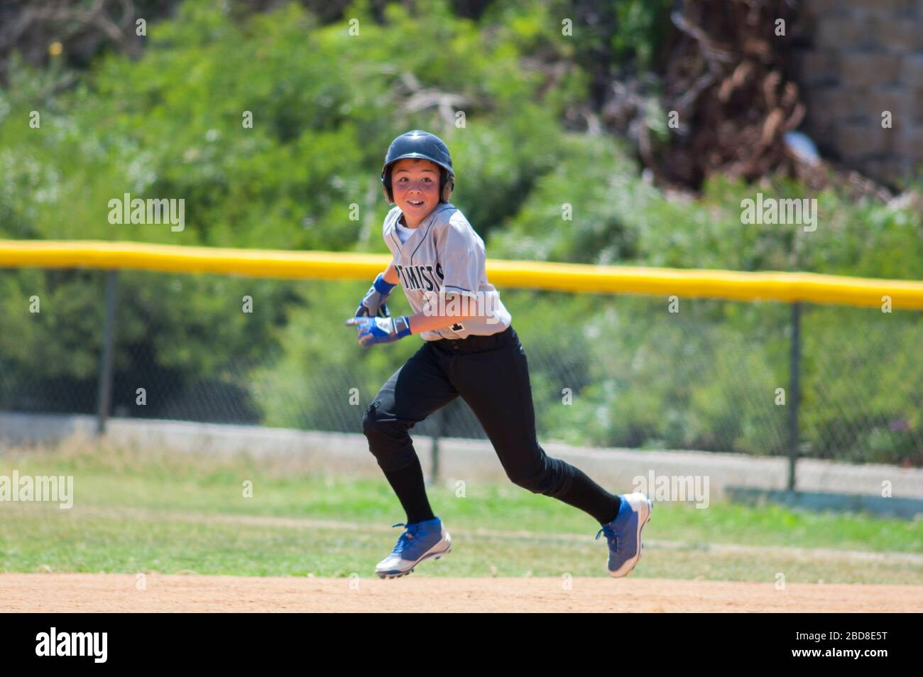 Images Portrait Studio donates to little league baseball and softball