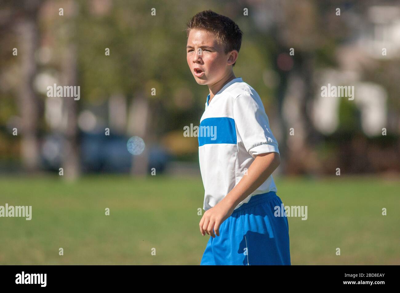 Teen soccer player yelling on the field Stock Photo