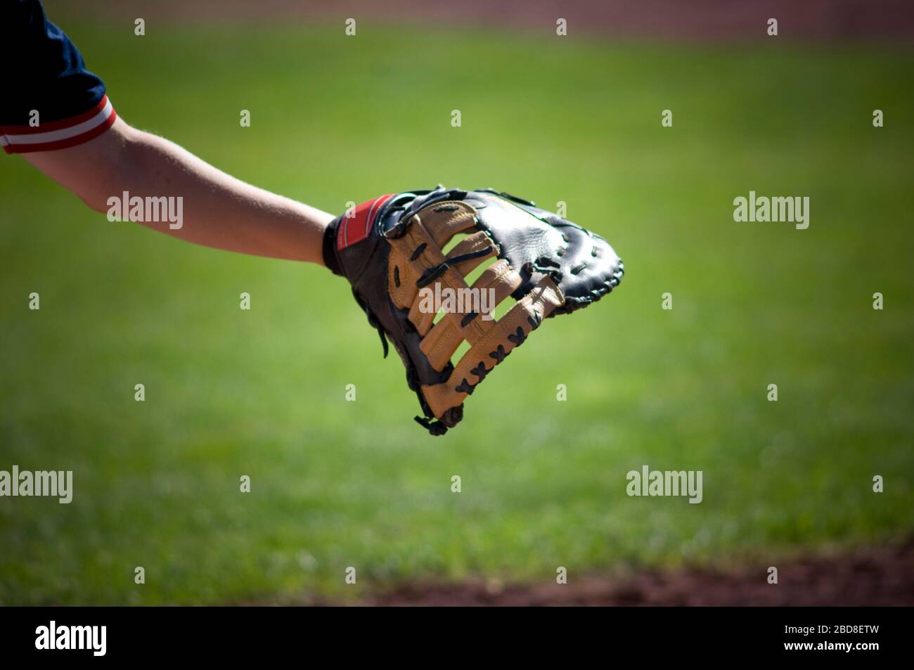 closeup of first baseman's glove reaching out Stock Photo Alamy