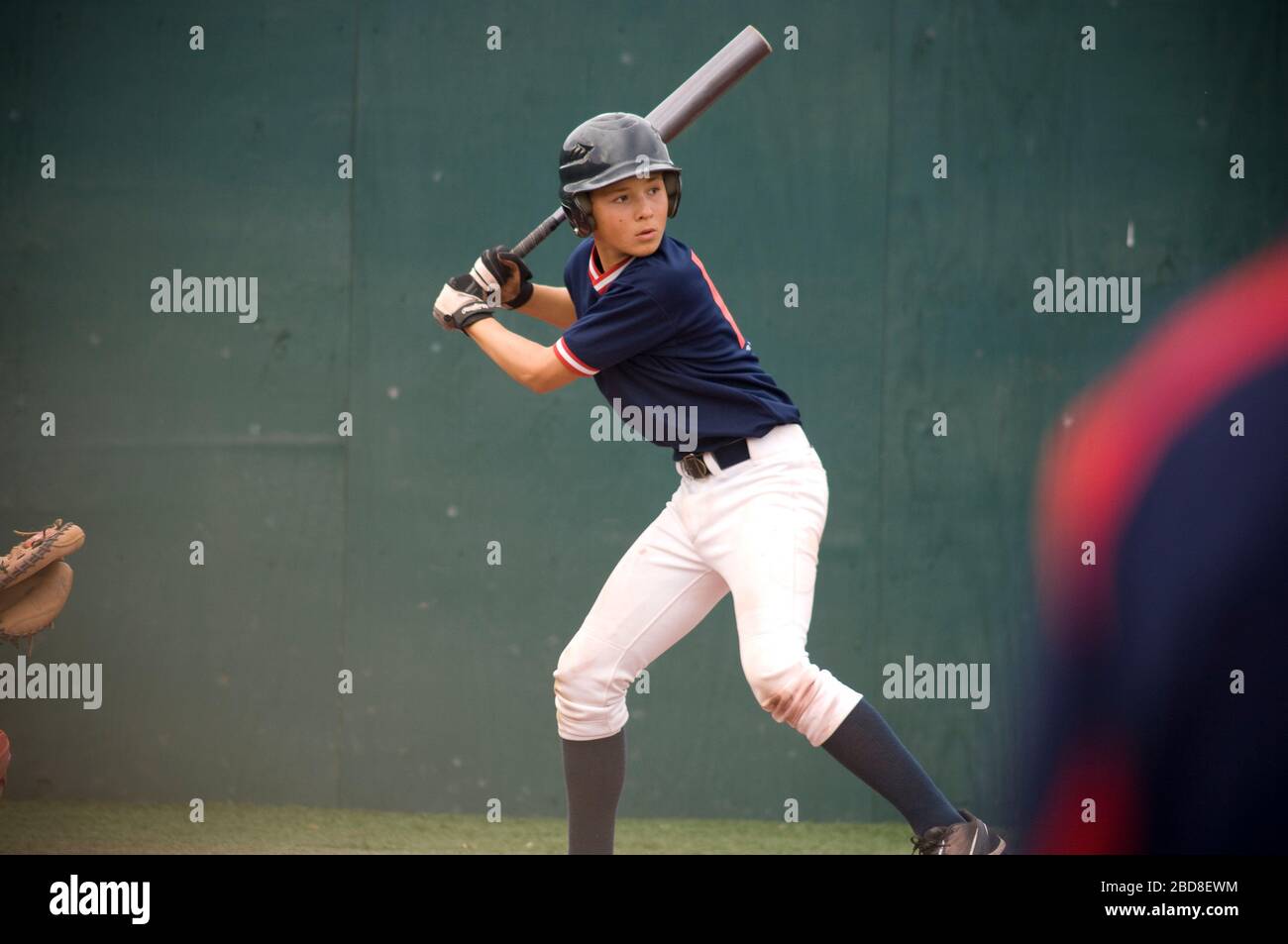 Young baseball player in batters box ready to swing Stock Photo Alamy