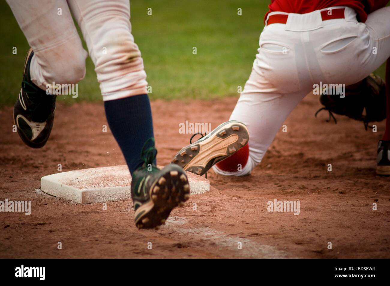 Closeup of runner crossing first base Stock Photo Alamy