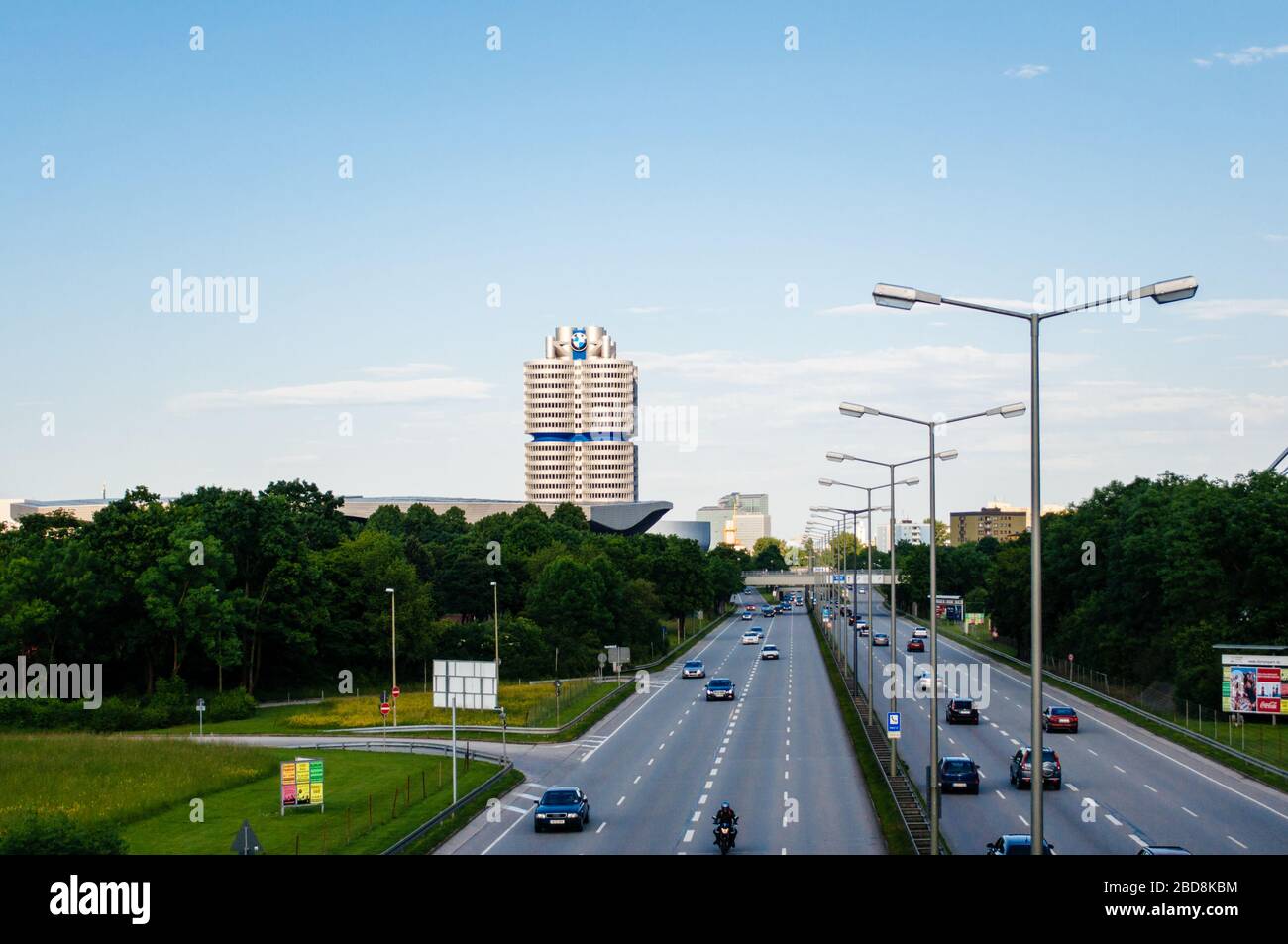 Munich, Germany - Jun 6, 2010: Aerial overhead view of BMW-Vierzylinder English: BMW four-cylinder HQ Tower serving as world headquarters for Bavarian automaker since 1973 - highway cars and cityscape Stock Photo