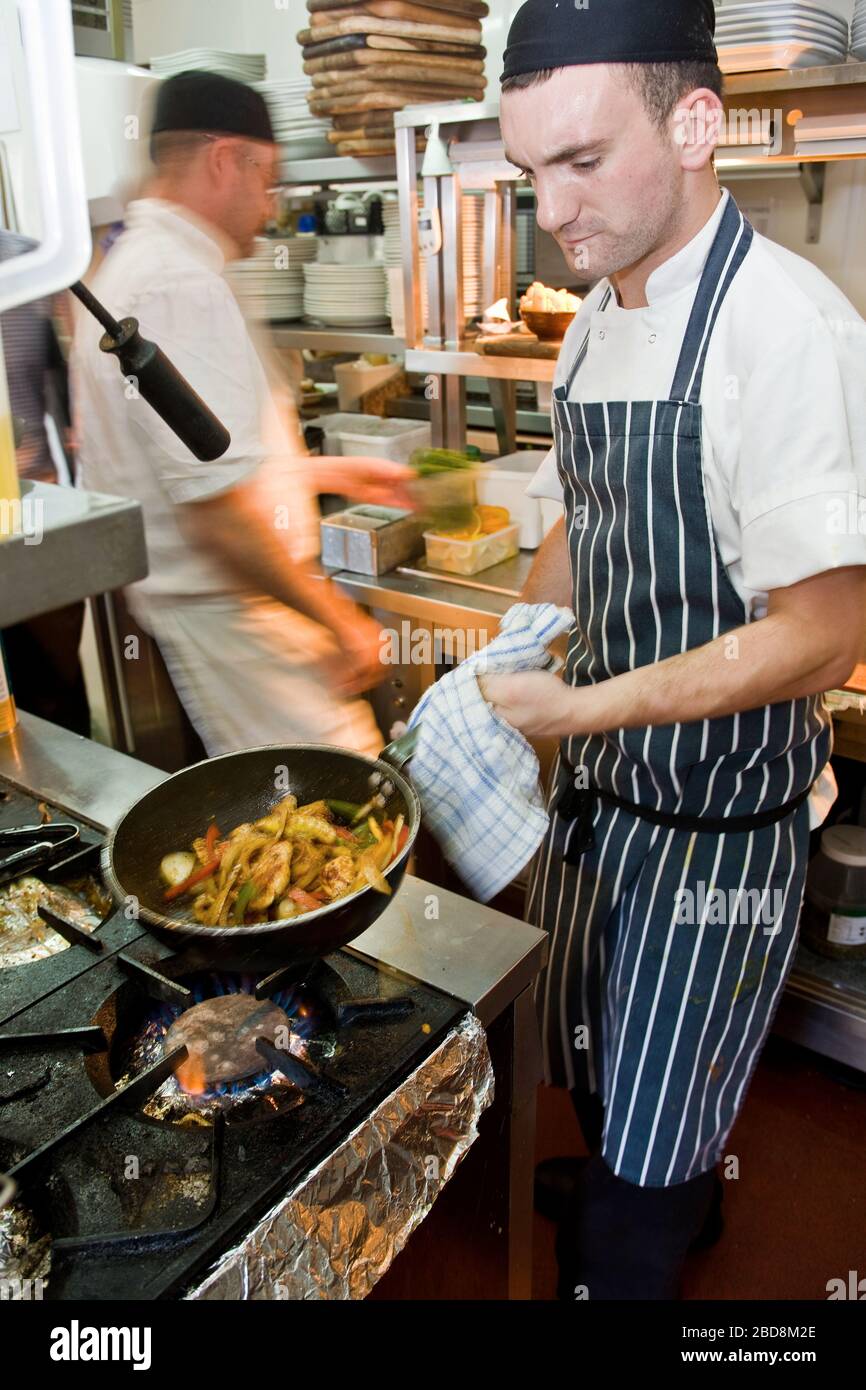 chefs working at commercial kitchen in the UK Stock Photo Alamy
