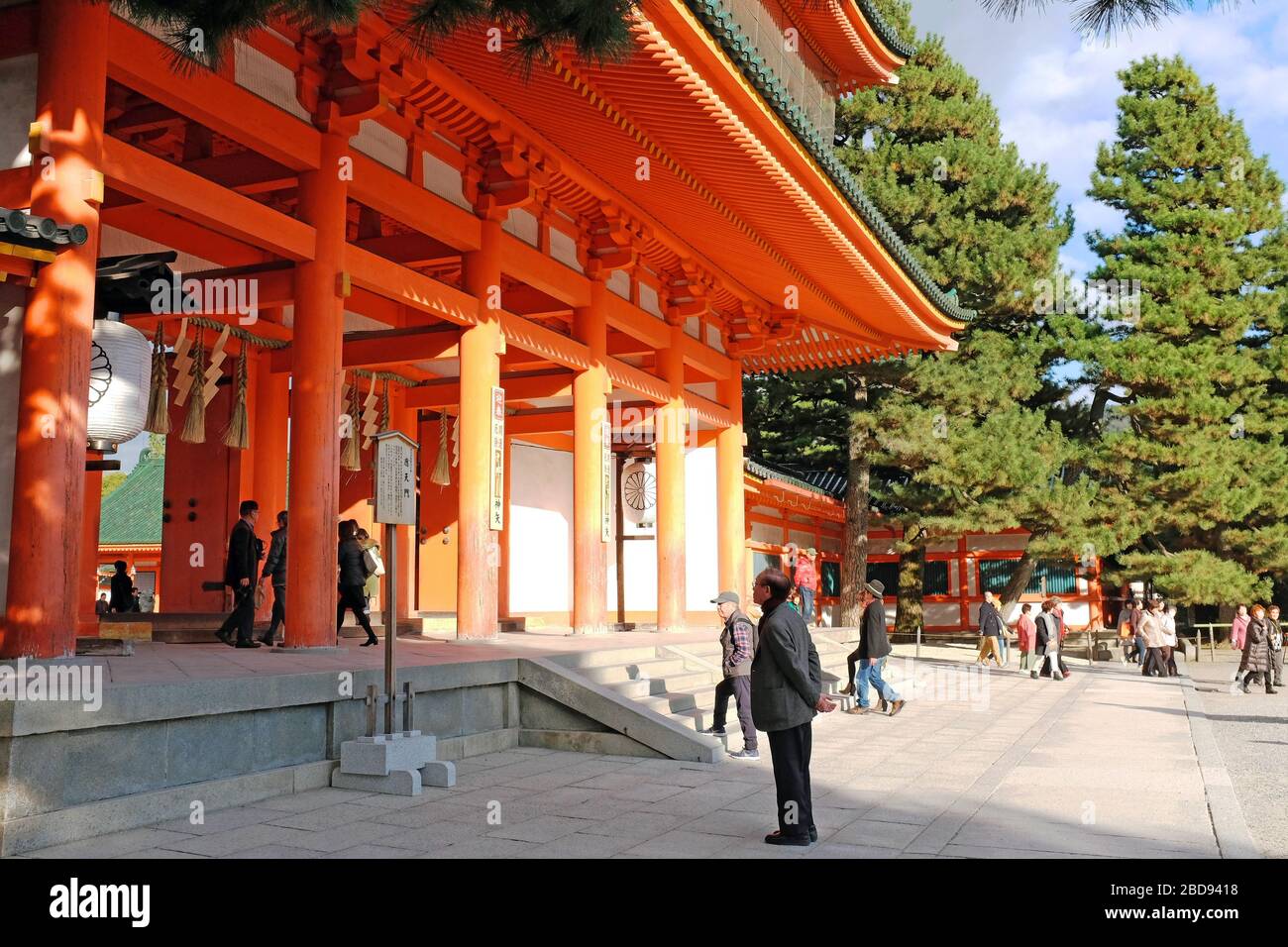 Heian Jingu shrine was built in 1895.  A man stands and ponders outside the Otenman gate entrance at this Kyoto, Japan attraction. Stock Photo