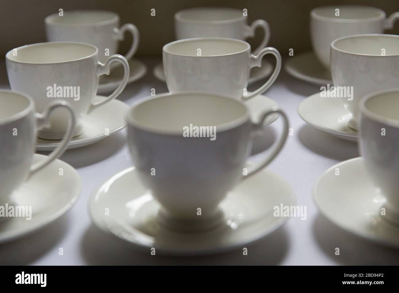 Coffee and tea cups awaiting to be served to wedding guests Stock Photo