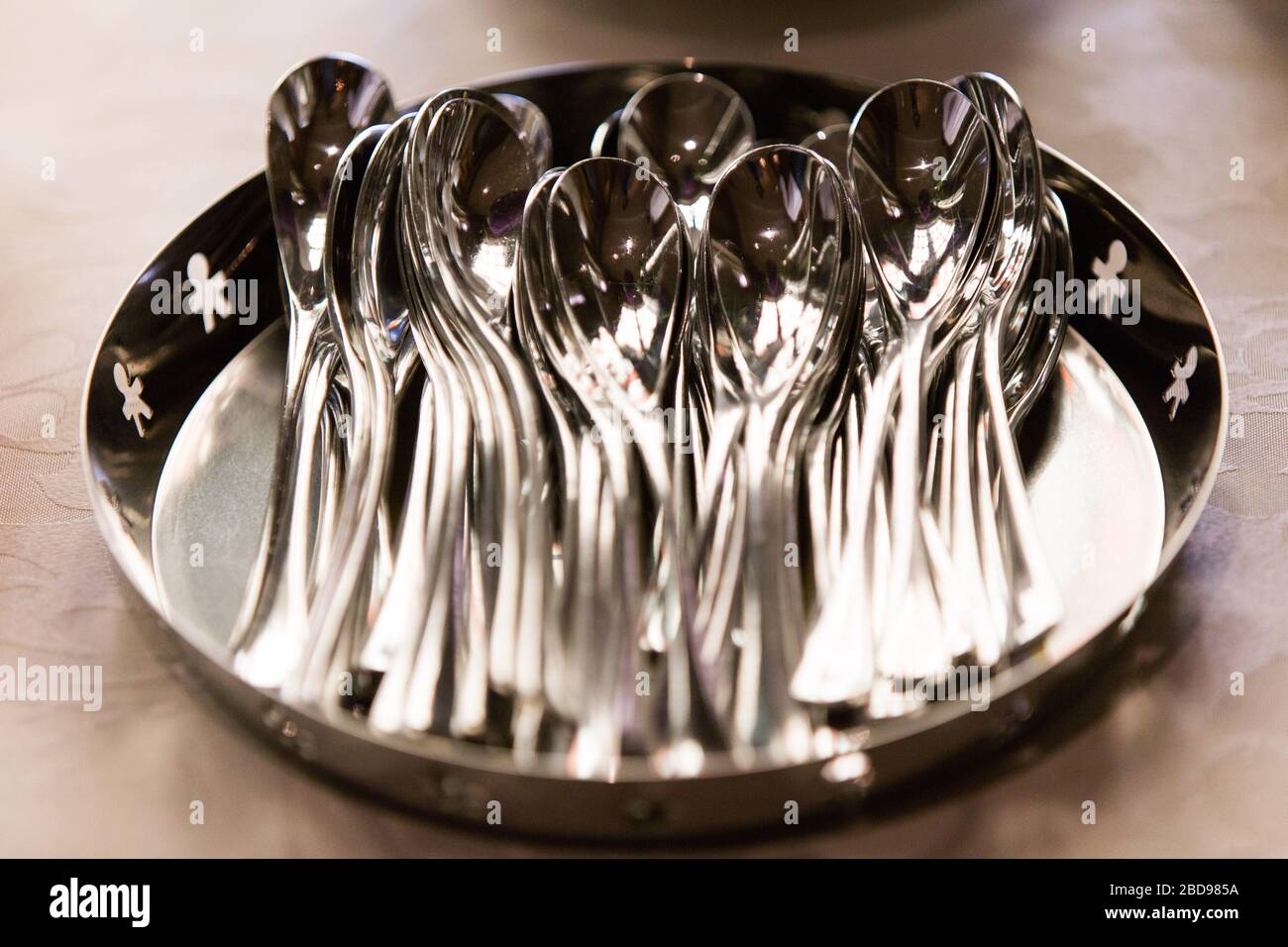 A tray of dessert silver spoons Stock Photo