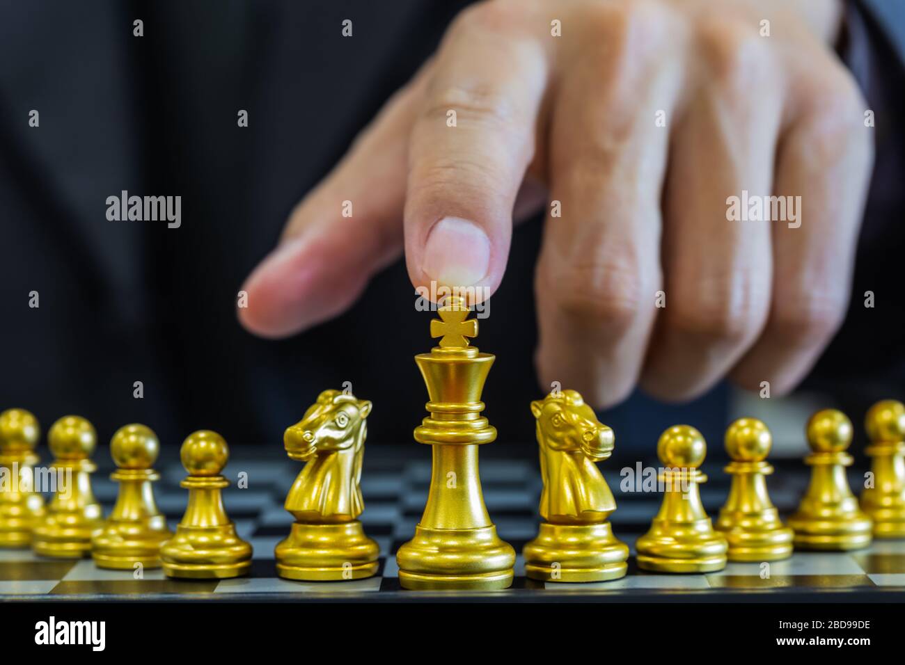 Chess game on chess board behind business man background. Business concept  to present financial information and marketing strategy analysis. Investmen  Stock Photo - Alamy