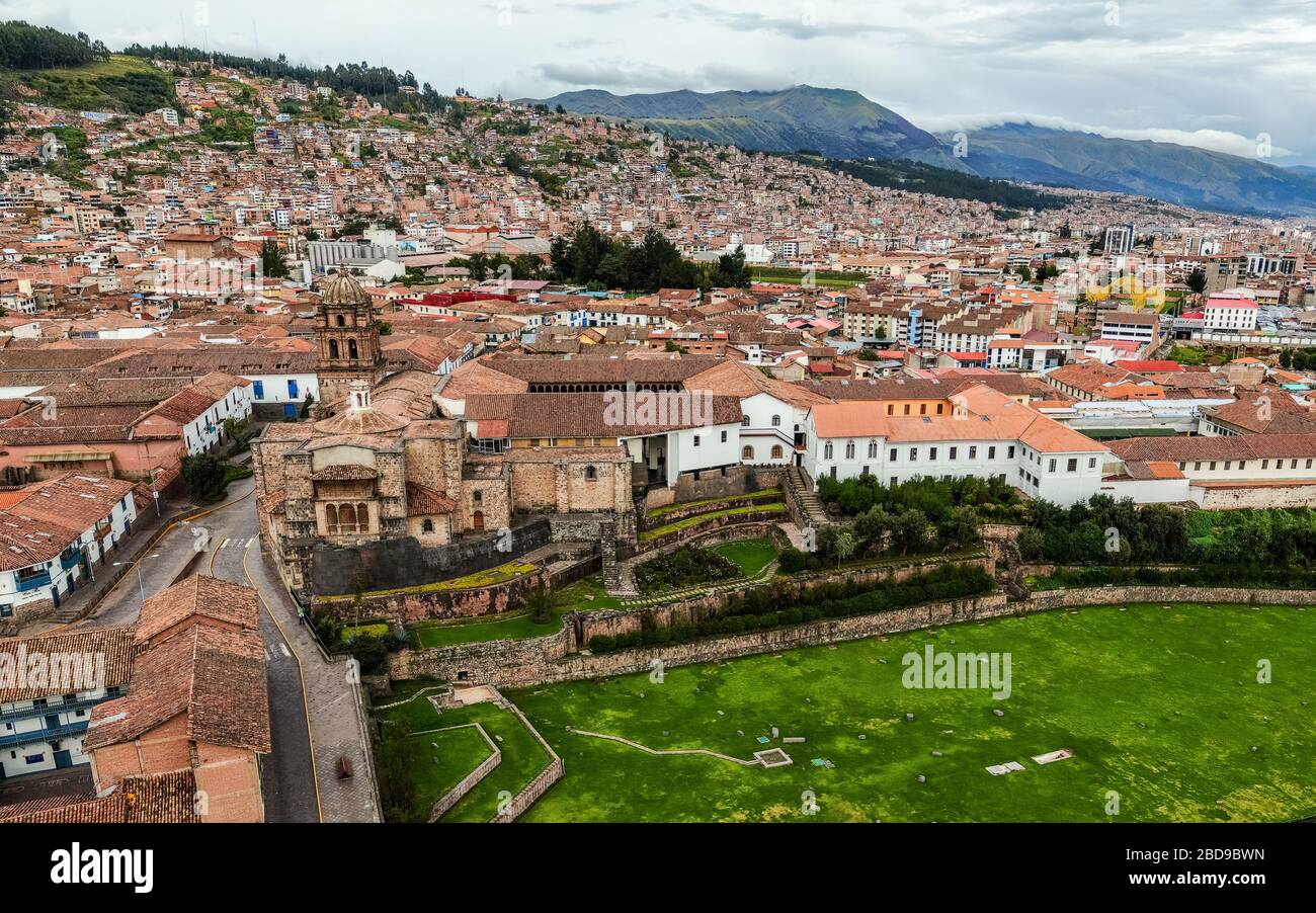 Aerial view over empty Qorikancha gardens, Inca temple of the Sun in Cusco, and the empty streets of the city because of Coronavirus lockdown Stock Photo