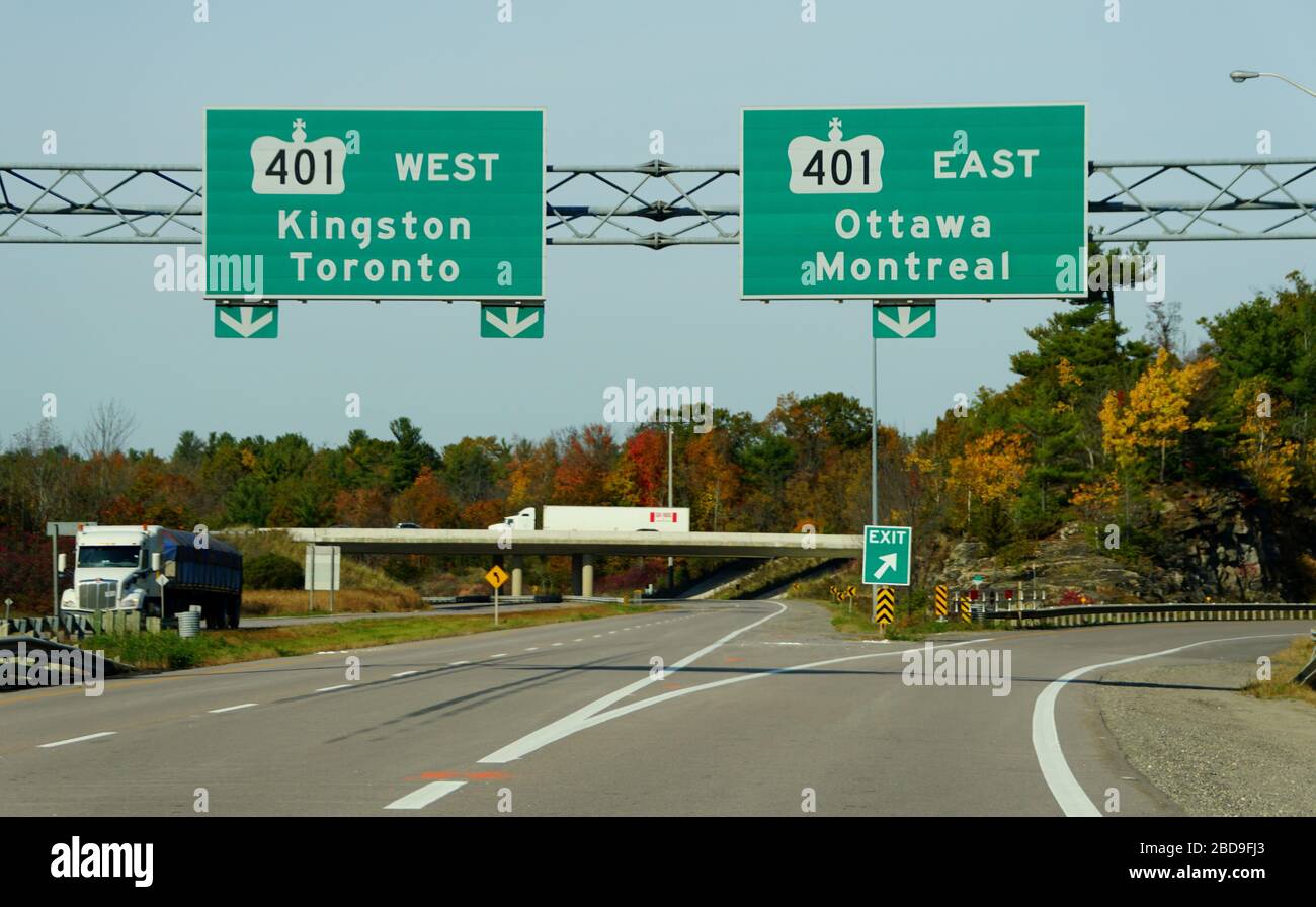 Ontario, Canada - October 28, 2019 - The view of the highway on Route 401 splits with striking fall foliage Stock Photo