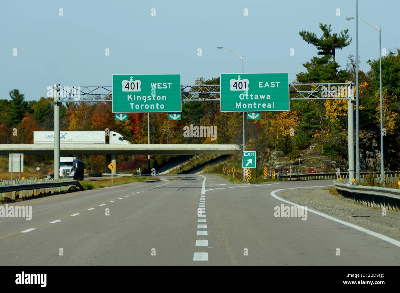 Ontario, Canada - October 28, 2019 - The view of the highway on Route 401 splits with striking fall foliage Stock Photo