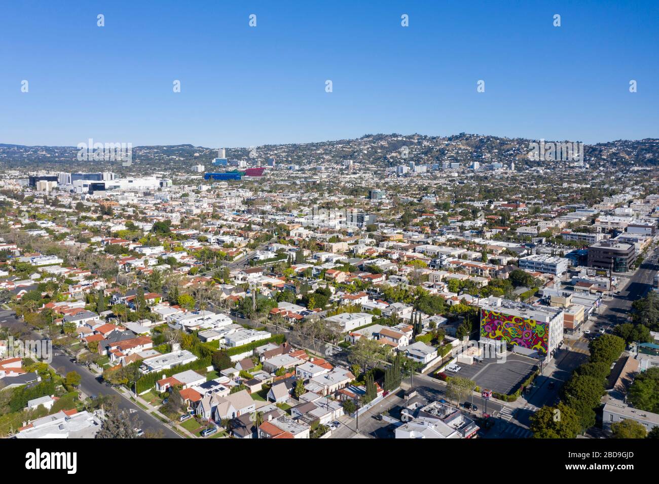 Aerial views over Mid-Wilshire in central Los Angeles under a blue sky Stock Photo
