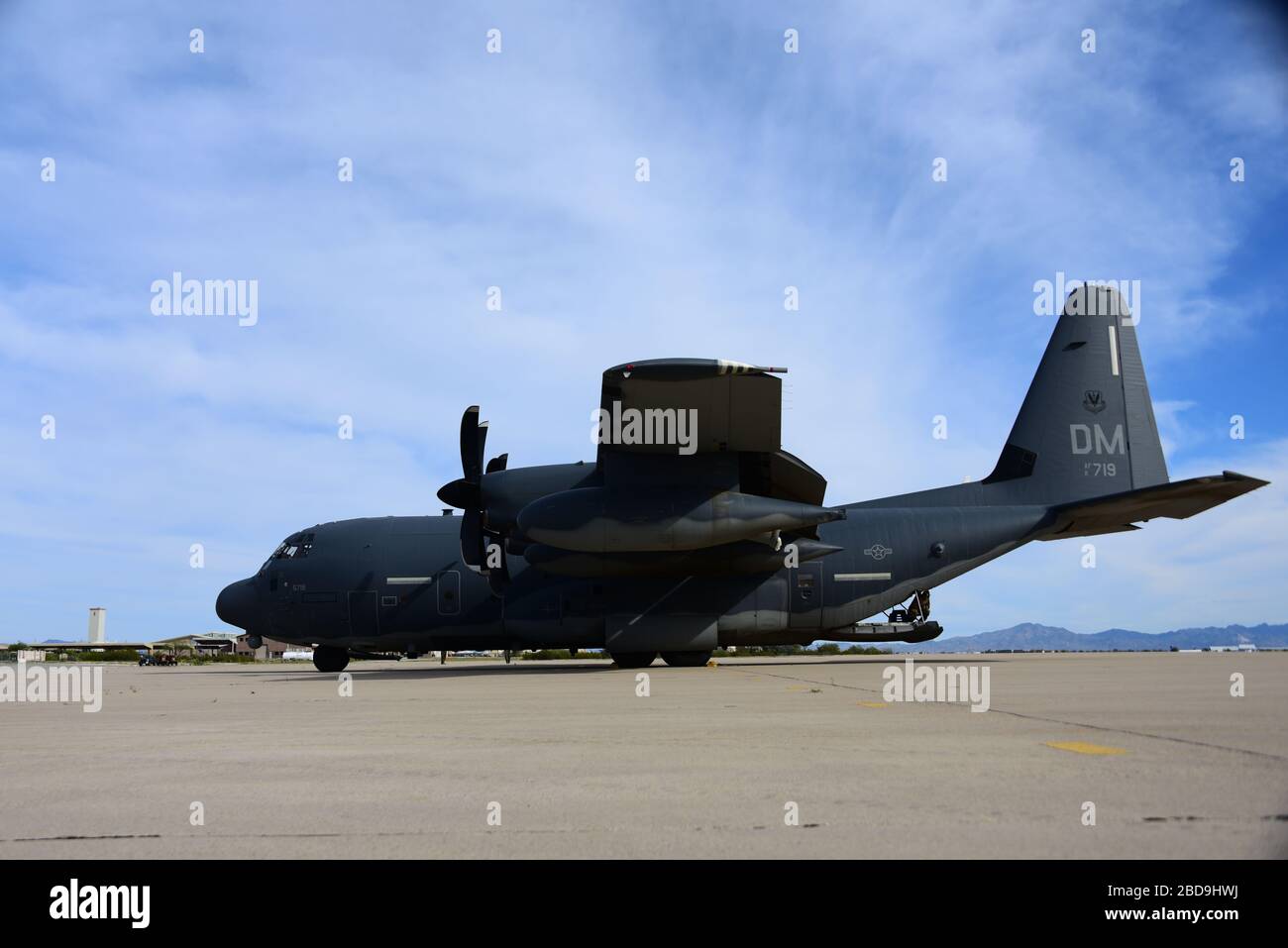 A U.S. Air Force HC-130J Combat King II sits on the flight line at ...