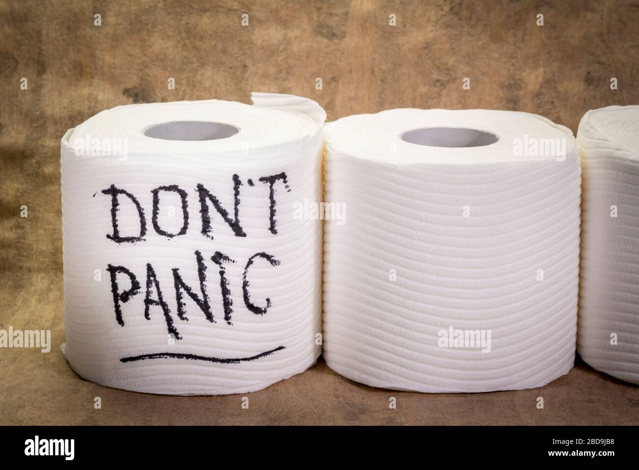 don't panic message - handwriting on a roll of a toilet paper, covid-19 coronavirus pandemic and crisis Stock Photo