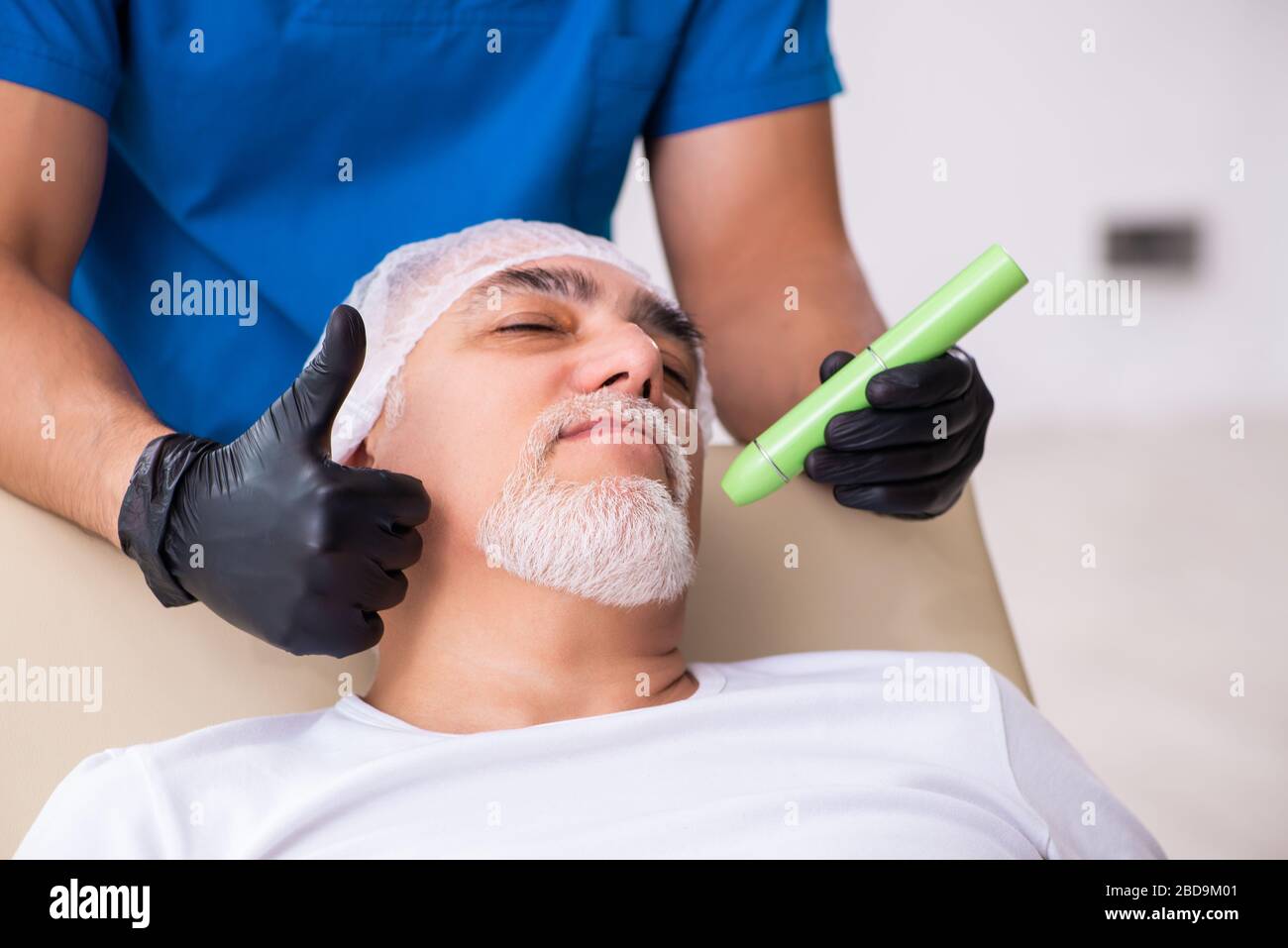 Old man visiting doctor for plastic surgery Stock Photo