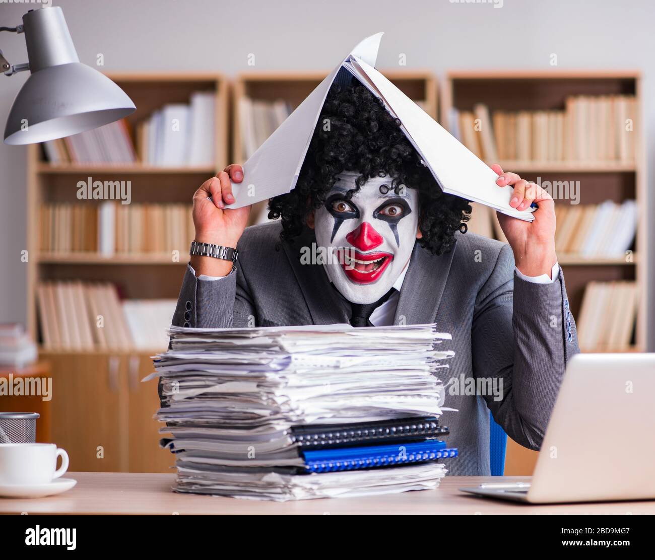 Work Cloan The clown businessman working in the office Stock Photo - Alamy